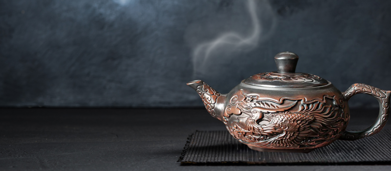 Enrich your tea ceremonies with the Purple Pottery Vintage Teapot, a meticulously crafted piece influenced by traditional Chinese tea culture. Handmade from premium ceramic adorned with intricate carvings, this Kung Fu teapot seamlessly blends elegance with functionality, serving as the ideal vessel for brewing and presenting your beloved teas.